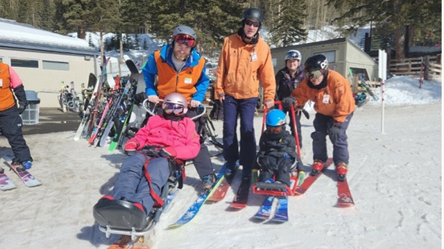  Special Education faculty Dr. Veronica Moore and UNM alums Jen Geier and Karli Mercure with students on the ski slope