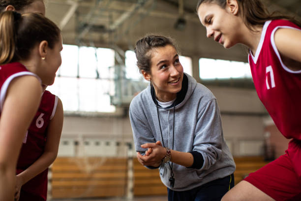 Basketball Coach with players