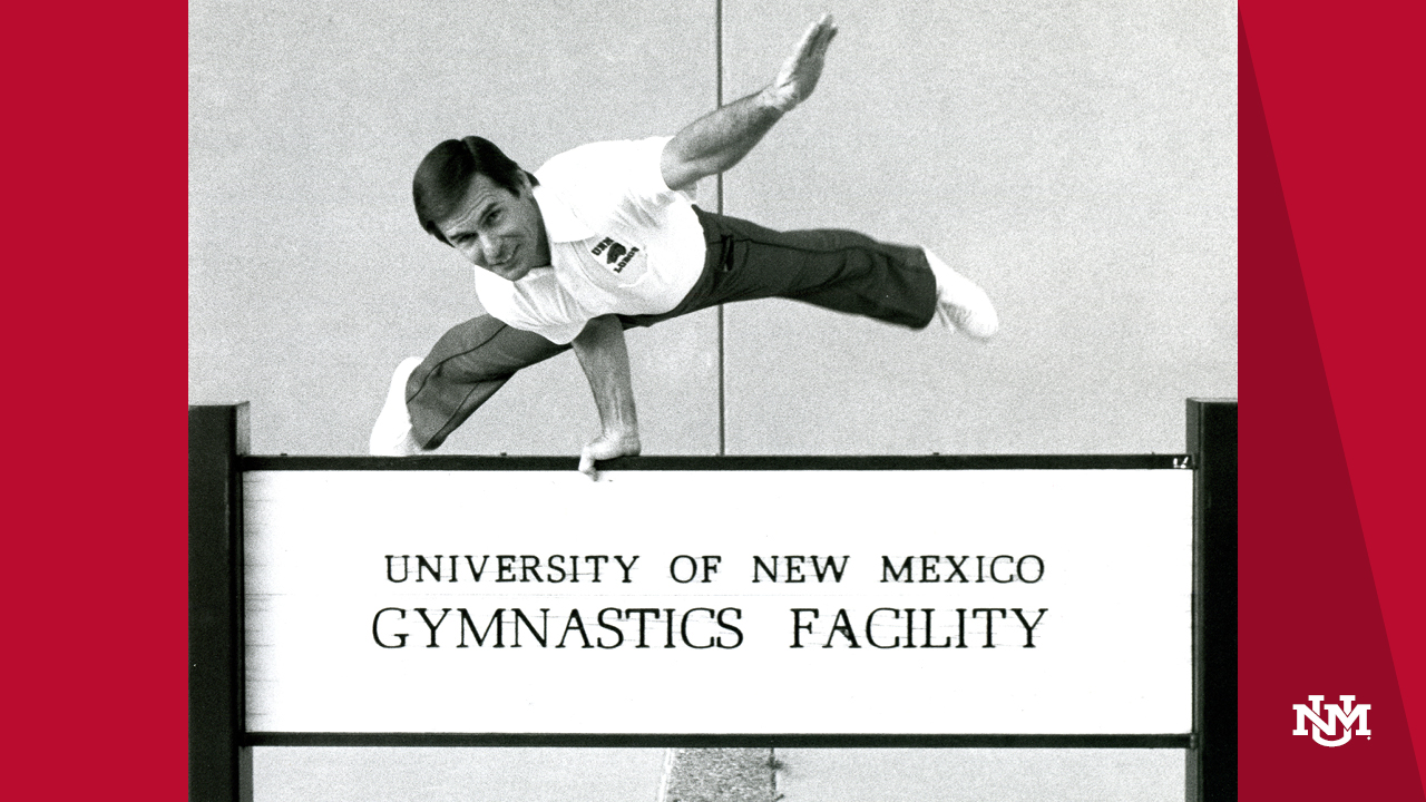 Photo of main balancing on UNM Gymnastics Facility sign