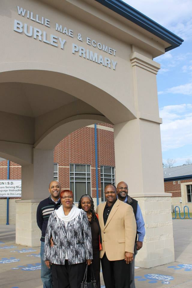 Hansel Burley and his four siblings standing in front of a school