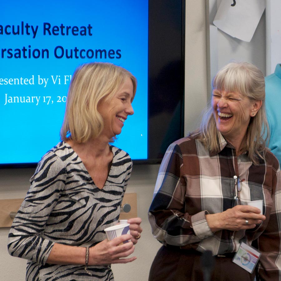 Photo of COEHS faculty laughing
