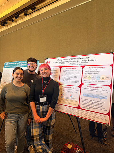 photo of students in front of research poster