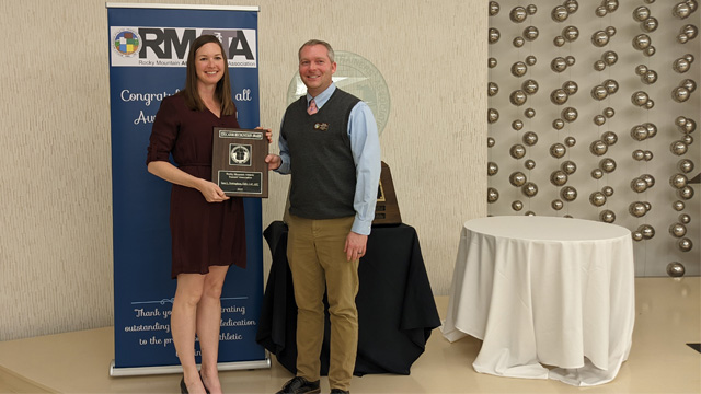 Photo of Dr. Sara Nottingham receiving the award from Rocky Mountain Athletic Trainers' Association